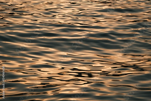 Obraz Golden blue sparkling water under the sunset