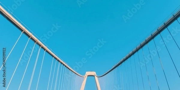 Fototapeta Construction infrastructure highway progress concept. Modern suspension bridge against a clear blue sky.
