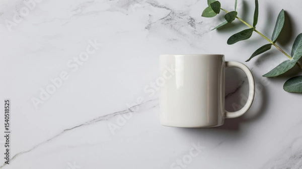 Obraz Minimalist flat lay of white ceramic coffee mug on marble with eucalyptus sprig and soft shadows

