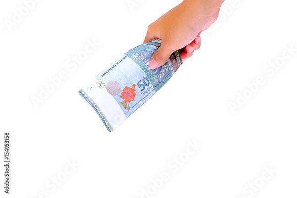 Obraz Hand holding Malaysia Ringgit money isolated on white background.