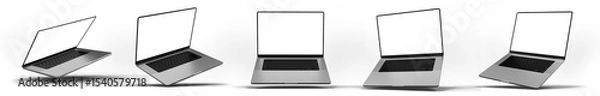 Obraz A set of laptops with blank screens shown from various abstract angles against a transparent background, showcasing a modern technology design. 3D render