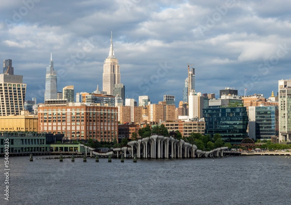 Obraz Tall office and apartment buidlings along the waterfront in Manhattan by Pier 57 and Little Island seen from Hudson