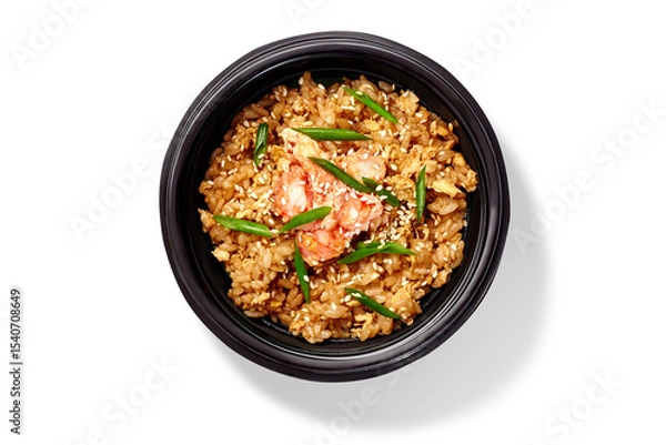 Fototapeta Wok rice with shrimps, eggs and sesame seeds in black bowl