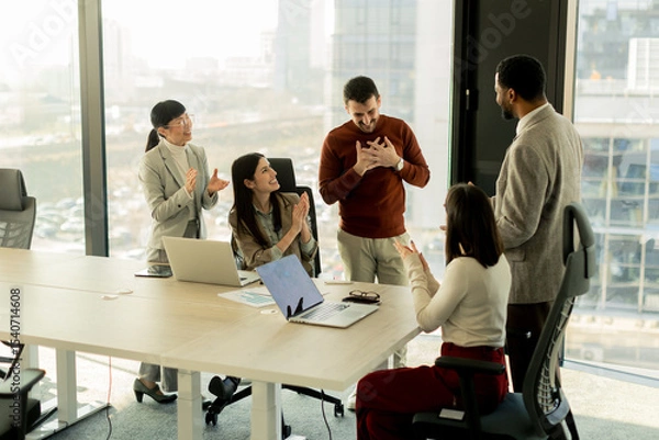 Obraz Collaboration among diverse professionals in modern office space during a strategic meeting