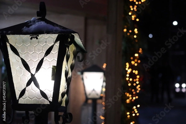Obraz Glowing street lights and festive garlands.