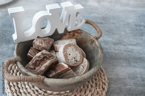 Fototapeta Assortment of halva. Uzbek cuisine. Halva is a sweet confectionery product made from ground sesame seeds or sunflower seeds combined with sugar and nuts. Oriental sweets