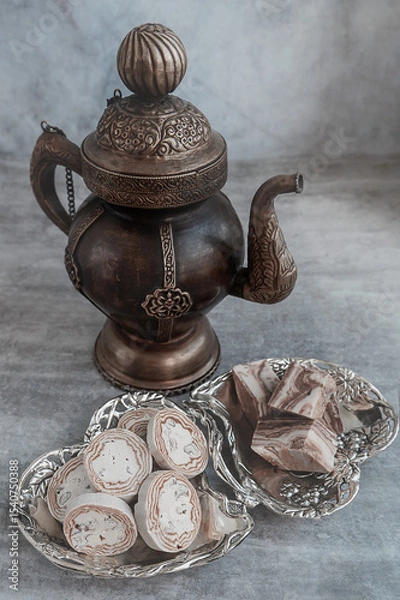 Fototapeta Assortment of halva. Uzbek cuisine. Halva is a sweet confectionery product made from ground sesame seeds or sunflower seeds combined with sugar and nuts. Oriental sweets