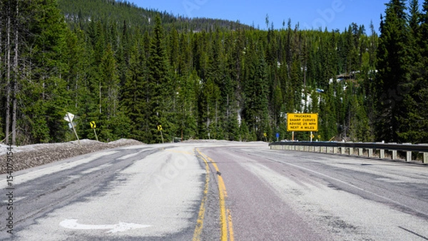 Fototapeta View east into Montana on US highway 12 at Lolo Pass with sharp curve warning