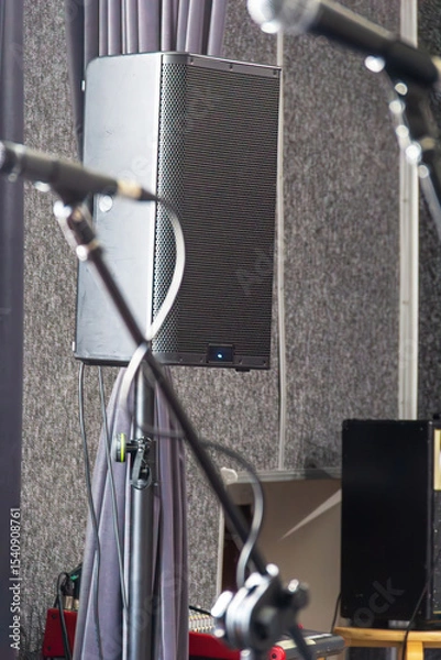 Fototapeta Sound system setup in a rehearsal space during music practice session