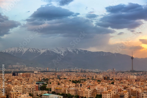 Obraz Beautiful cityscape sunset panorama of Tehran city, mountains and Milad tower in during colorful sunset in Iran