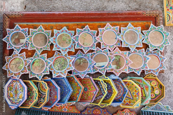 Fototapeta Scenic street view of market stalls and traditional Moroccan plates in the Old Town Medina area of Marrakech, west Morocco