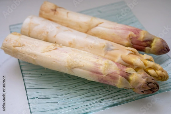 Fototapeta New season, fresh raw French violet-white asparagus vegetables large size, ripe and tasty
