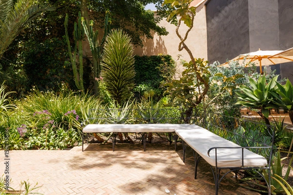 Fototapeta Scenic views of Le Jardin Secret as tourists visit the garden in Marrakech, west Morocco 