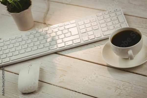 Fototapeta Keyboard with flower pot and coffee