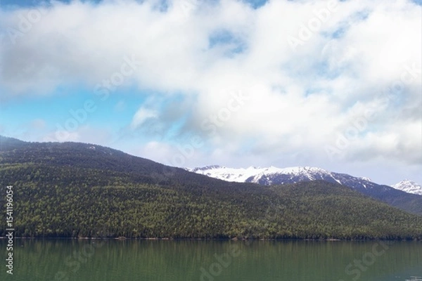 Obraz Mountains by river against sky