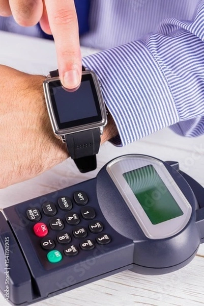 Obraz Man using smart watch to express pay