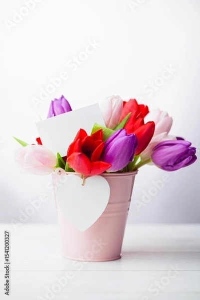 Obraz Flat illustration tulip bouquet is being placed in pink bucket with white card and heart tag