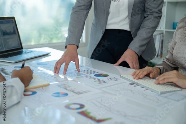 Fototapeta Business and Financial concept. Business team discussing assessment and evaluation of corporate show results of successful teamwork.
