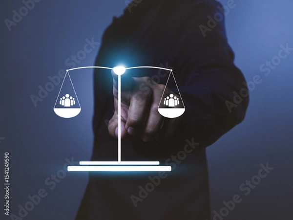 Fototapeta Businessman pointing at digital scale with people icons, concept of social balance and equality, dark background with blue tone, technology and justice theme
