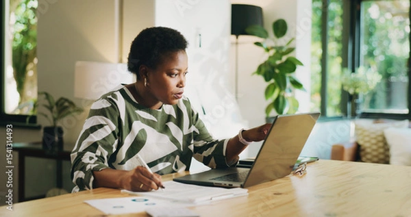 Obraz Bookkeeping, writing or black woman with laptop in home for account review, audit or tax returns. Remote work, accountant and reading financial report in house for asset management or budget expenses
