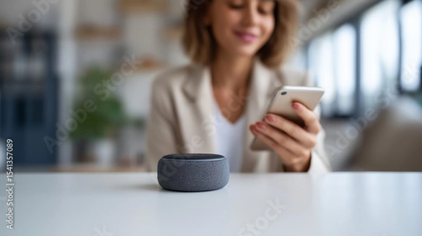 Fototapeta Smart speaker and smartphone technology integration in modern home office