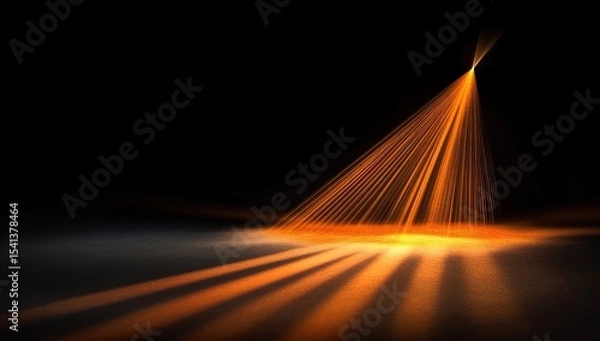 Obraz Abstract spotlight on dark stage.  Orange light rays, cone shape,  illuminating a shadowed surface