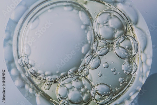 Obraz A macro image of oil and water bubbles over a sponge-like surface with soft gradients. The abstract composition evokes themes of skincare, moisture, and organic texture