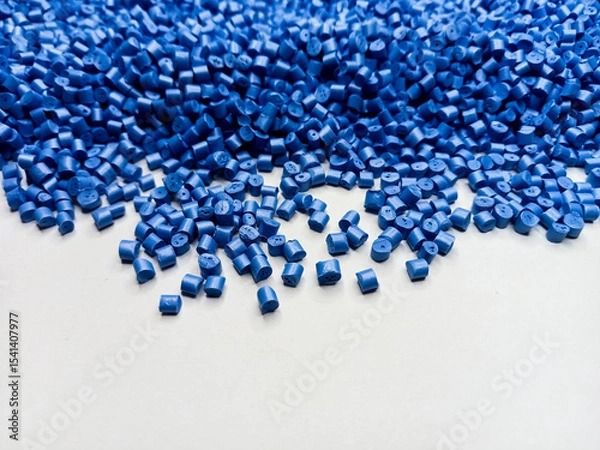 Fototapeta Blue polymer granules, blue masterbatch granules, cold cutting material type, isolated on white background for product catalog design of plastic manufacturing industry company profile