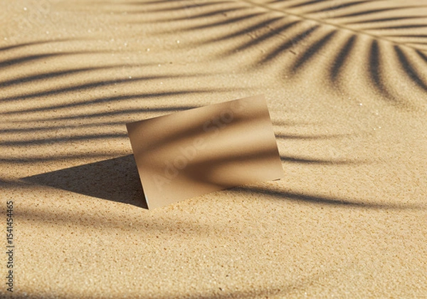 Fototapeta Blank business card mockup on sand with palm leaf shadows