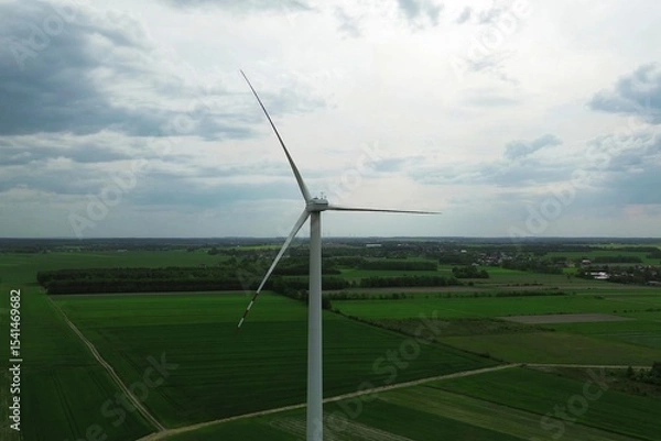 Fototapeta Skyline with modern turbine and dark clouds
