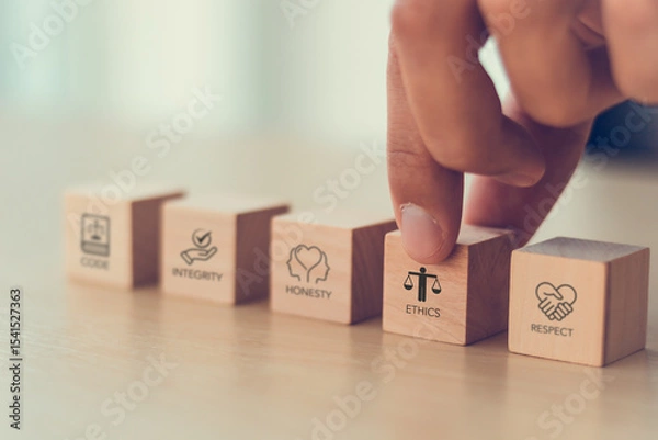 Obraz Code of conduct in business concept. Wooden blocks with code of conduct icons; code, integrity, honesty, respect, and ethics,  the foundation of a strong corporate code of conduct. Corporate ethics.