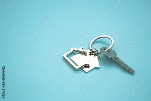Obraz keys on a blue background. concept of insurance, financing, housing, administrative buildings and business. Copy space