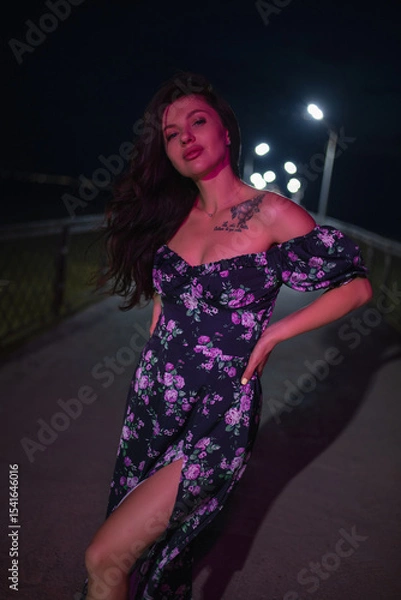 Obraz Woman in red light posing at the night pier
