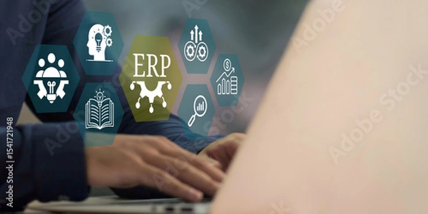 Fototapeta A young person using laptop with ERP Enterprise Resource Planning System Concept on visual screen.
