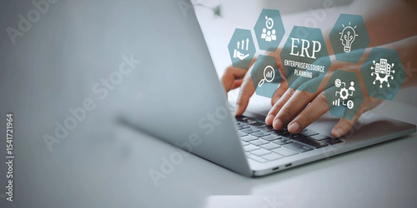 Fototapeta A young person using laptop with ERP Enterprise Resource Planning System Concept on visual screen.