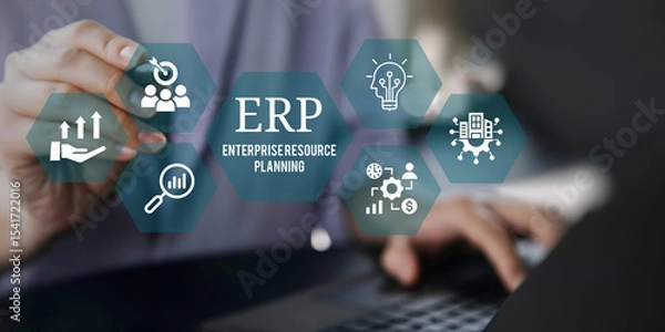 Fototapeta A young person using laptop with ERP Enterprise Resource Planning System Concept on visual screen.
