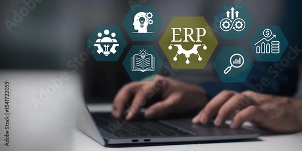 Fototapeta A young person using laptop with ERP Enterprise Resource Planning System Concept on visual screen.