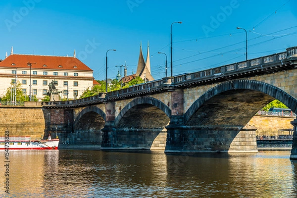 Fototapeta A view from the Vltava river towards the Palacke bridge in Prague in springtime