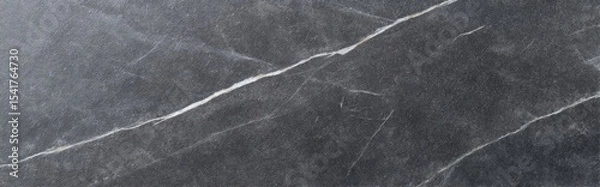 Fototapeta Honed Soapstone slab with natural veining texture in closeup macro background