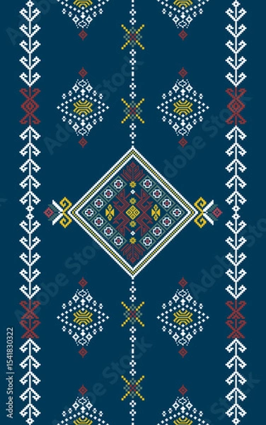 Fototapeta Traditional geometric embroidery pattern with diamond shapes and intricate motifs in red, yellow, and white on a dark blue background.