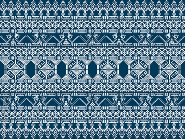 Fototapeta A detailed geometric textile pattern in navy blue and cream, featuring intricate symmetrical designs and ornamental motifs.