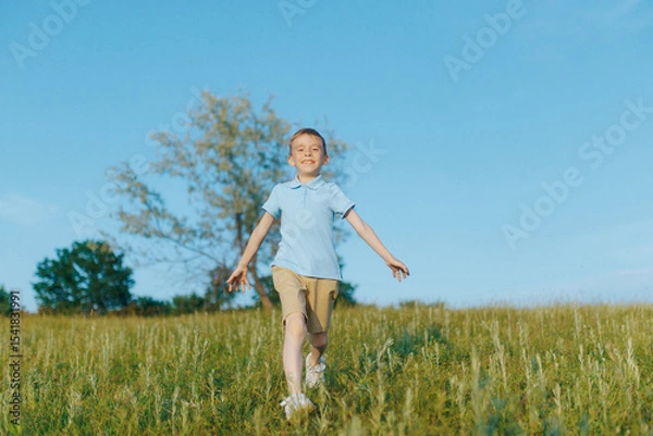 Fototapeta Child running and leaping for joy, full of energy and happiness