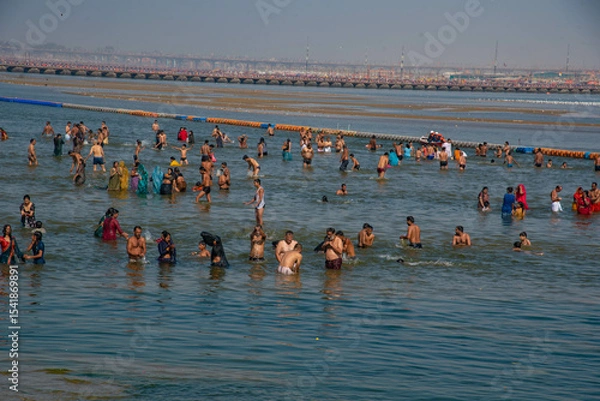 Fototapeta group of people walking on beach