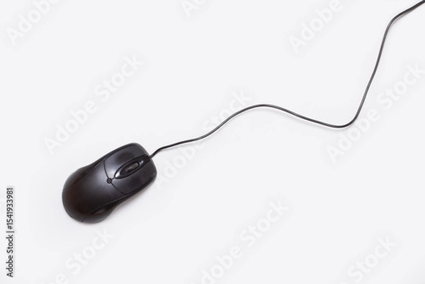 Fototapeta A black computer mousse with cable on a white background