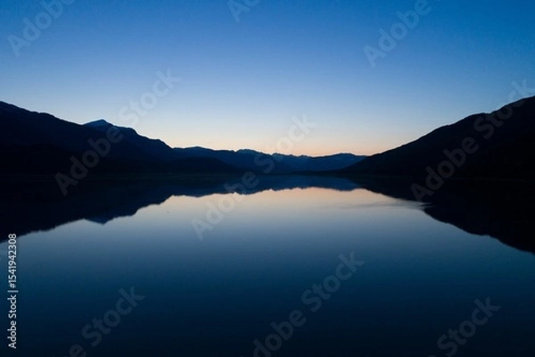 Obraz Scenic view of lake against clear blue sky