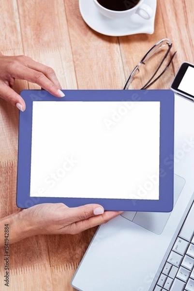 Fototapeta Overhead of feminine hand using tablet