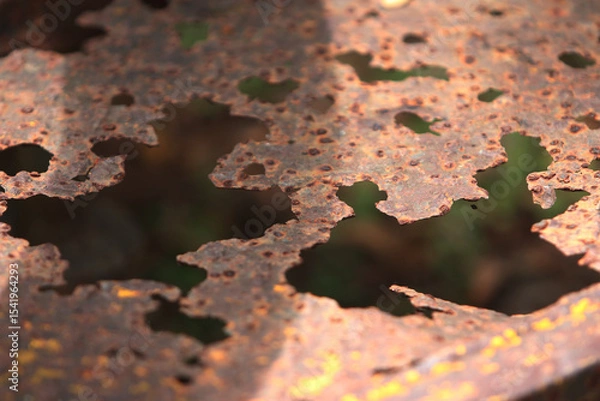 Fototapeta Weathered Metal: An abstract glimpse into the captivating textures of aged metal, revealing patterns of rust and decay in intricate detail. 