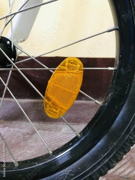 Obraz Urban bike wheel resting on tiled floor in indoor setting