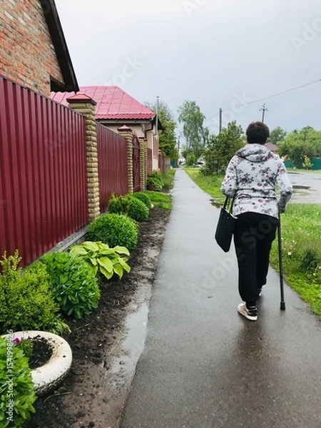 Obraz Active elderly person with a disability enjoying a walk outdoors