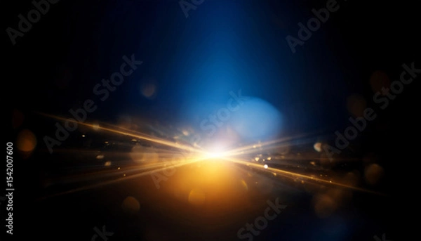 Obraz flare light blur optical leak defocused blue yellow golden color lens sparkle texture on abstract dark black background